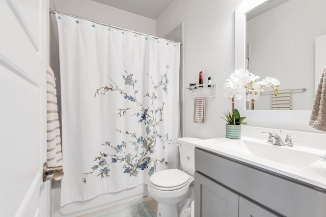 bathroom with toilet, vanity, and shower / bathtub combination with curtain
