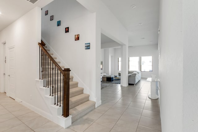 stairs with tile patterned flooring
