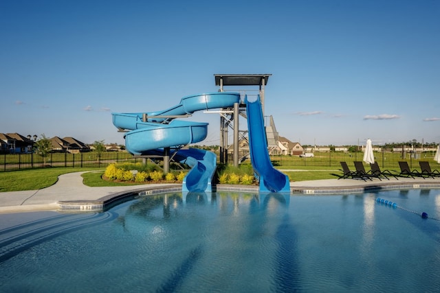 community pool with a water slide