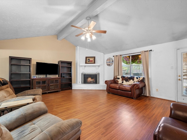 11602 Stone Bridge Dr, Houston, TX 77064 - living area featuring ceiling fan, wood finished floors, and a fireplace