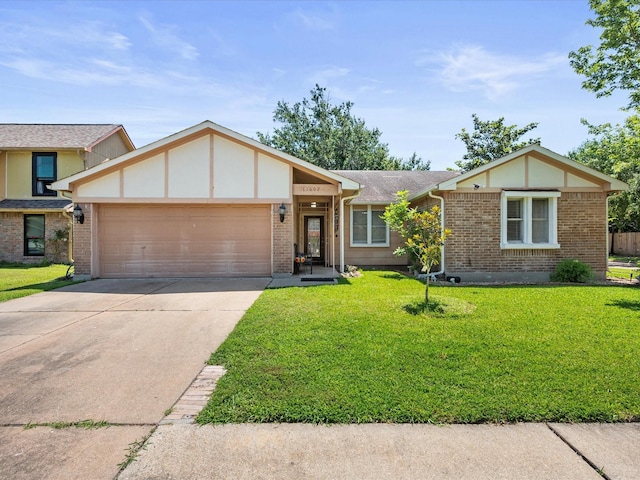 11602 Stone Bridge Dr, Houston, TX 77064 - view of front facade featuring a garage, driveway, a front yard, and brick siding