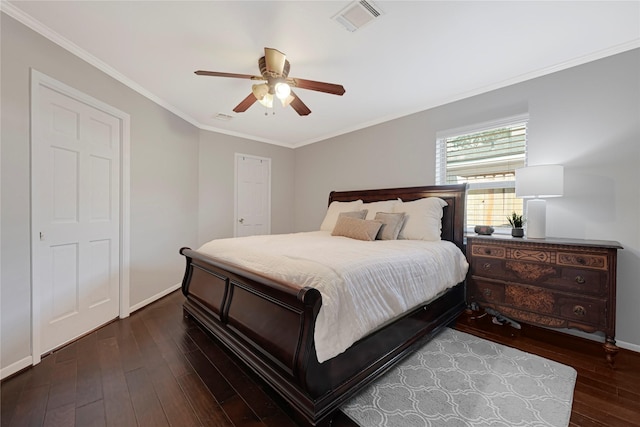 bedroom featuring ceiling fan, visible vents, hardwood / wood-style flooring, baseboards, and ornamental molding