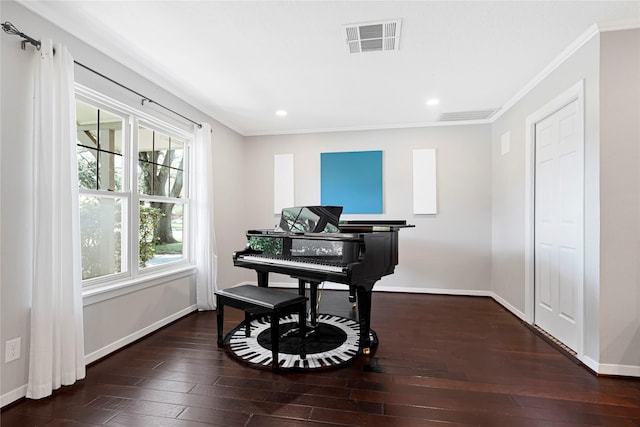 sitting room with baseboards, ornamental molding, hardwood / wood-style flooring, and visible vents