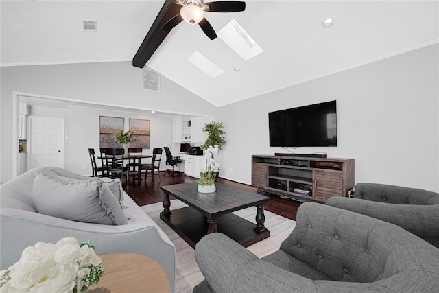 living area with ceiling fan, recessed lighting, wood finished floors, visible vents, and lofted ceiling with skylight
