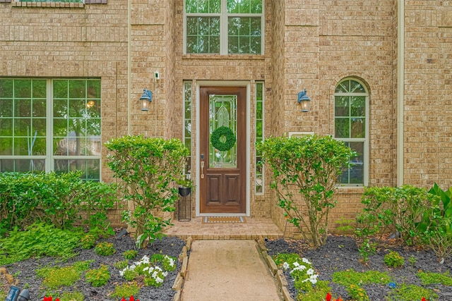 entrance to property with brick siding