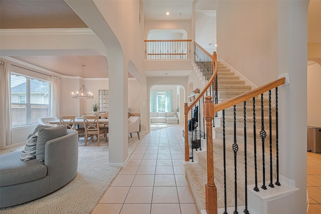 entryway featuring a healthy amount of sunlight, arched walkways, and light tile patterned floors