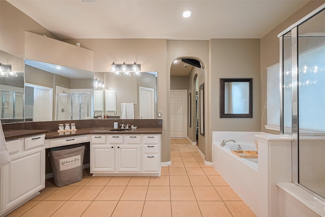 full bath with tile patterned flooring, vanity, recessed lighting, a shower stall, and a garden tub