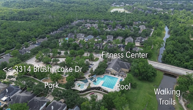 aerial view with a residential view and a wooded view