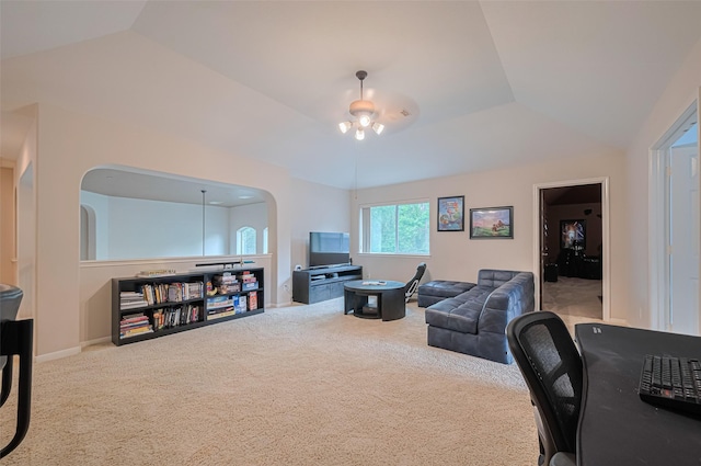 carpeted office with baseboards, arched walkways, and lofted ceiling