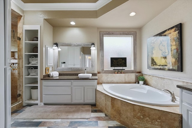 full bath featuring a bath, a shower stall, vanity, stone tile flooring, and ornamental molding