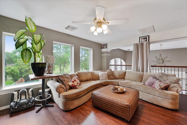 living area featuring a ceiling fan, hardwood / wood-style flooring, and visible vents