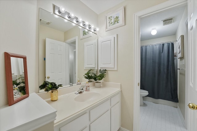 full bath featuring toilet, visible vents, tile patterned flooring, and vanity