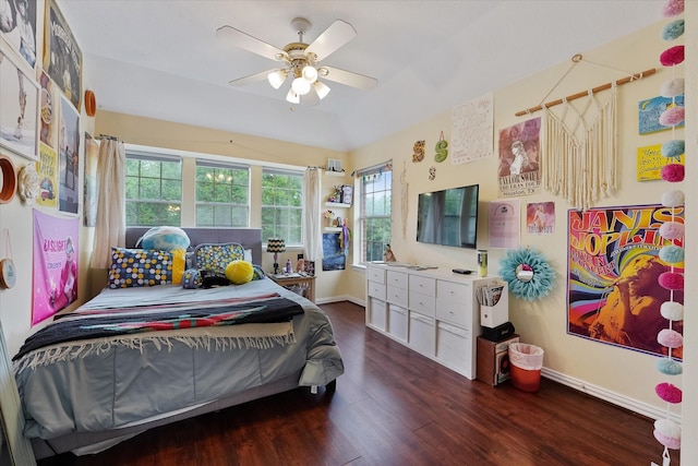 bedroom featuring baseboards, a ceiling fan, and wood finished floors