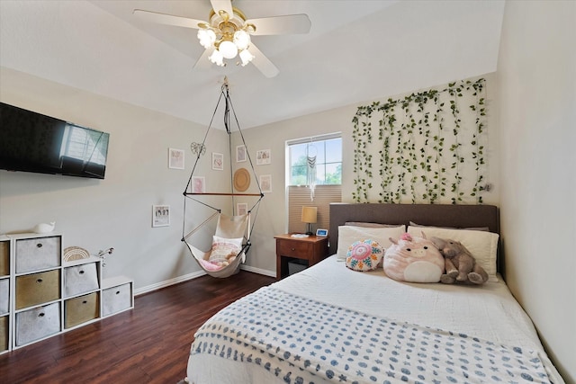 bedroom featuring baseboards, dark wood finished floors, and ceiling fan