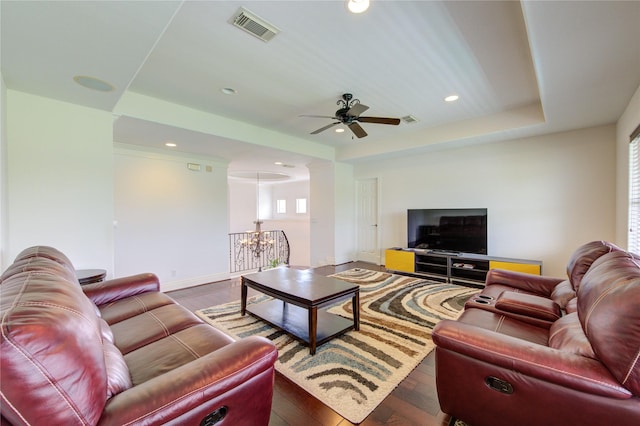 living area featuring recessed lighting, ceiling fan with notable chandelier, dark wood-style flooring, and visible vents