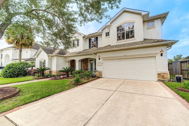 traditional home with an attached garage, stucco siding, stone siding, and concrete driveway
