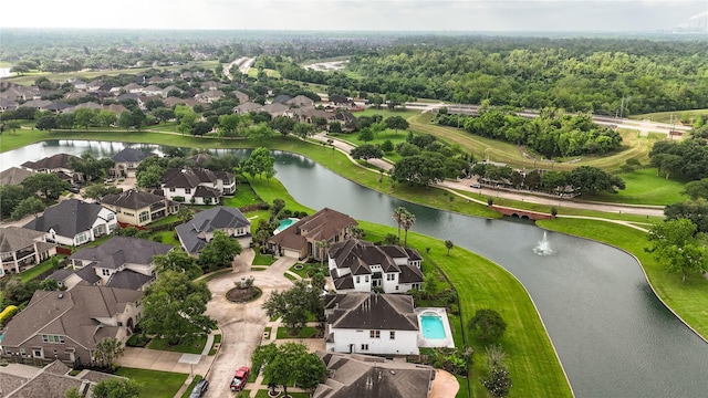 bird's eye view with a water view and a residential view