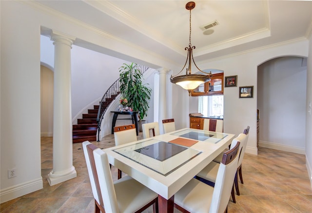 dining room featuring visible vents, arched walkways, ornate columns, and stairway