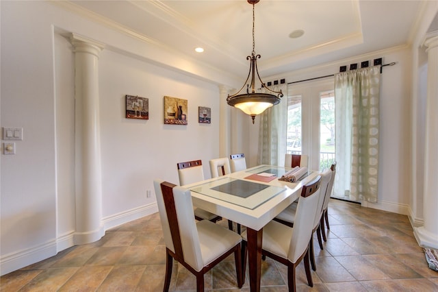 dining space with baseboards, a raised ceiling, ornate columns, ornamental molding, and recessed lighting