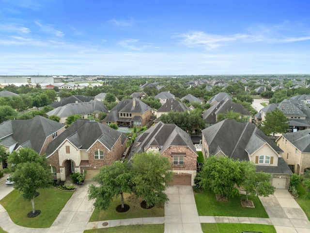 birds eye view of property with a residential view