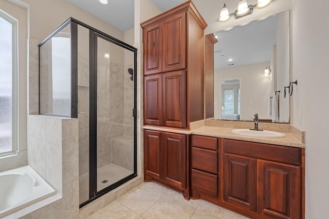bathroom with vanity, tile patterned flooring, visible vents, a bath, and a stall shower