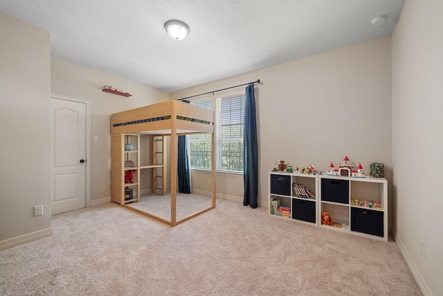 carpeted bedroom with baseboards