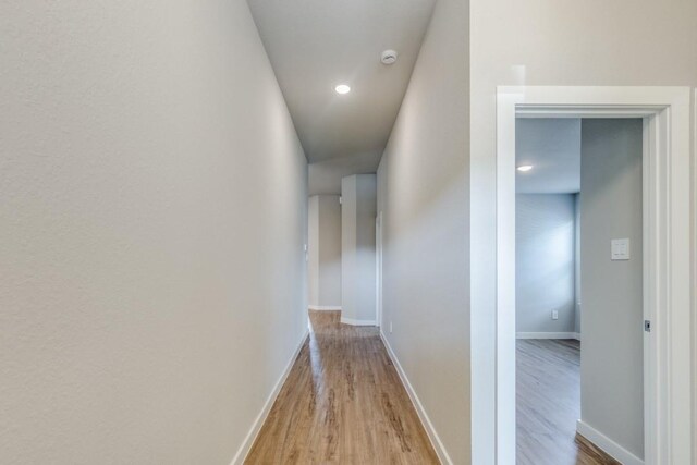 949 Gentle Moss Dr, Magnolia, TX 77354 - hall with wood finished floors, baseboards, and recessed lighting