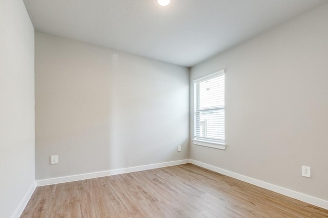 949 Gentle Moss Dr, Magnolia, TX 77354 - unfurnished room featuring baseboards and light wood finished floors