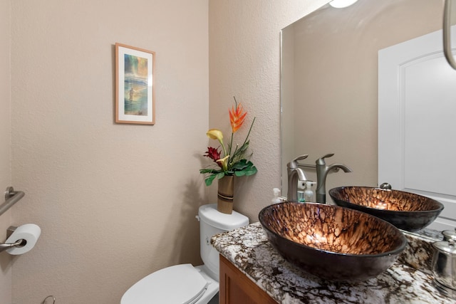 19486 Humaya Dr, Porter, TX 77365 - bathroom with vanity, a textured wall, and toilet