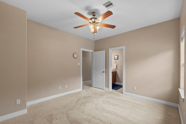 19486 Humaya Dr, Porter, TX 77365 - unfurnished bedroom with ceiling fan, light colored carpet, ensuite bath, baseboards, and visible vents