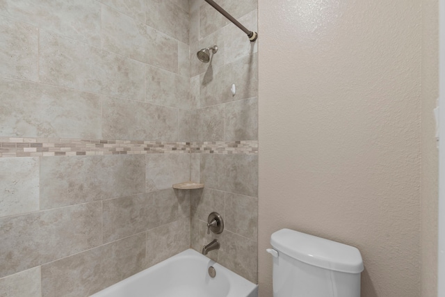 19486 Humaya Dr, Porter, TX 77365 - full bath featuring shower / bathtub combination, a textured wall, and toilet