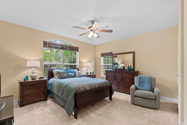 19486 Humaya Dr, Porter, TX 77365 - bedroom with visible vents, a ceiling fan, baseboards, and light carpet