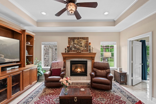 19486 Humaya Dr, Porter, TX 77365 - living area with a raised ceiling, ornamental molding, and a fireplace