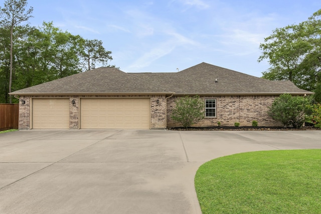 19486 Humaya Dr, Porter, TX 77365 - ranch-style home with a garage, a front yard, brick siding, a shingled roof, and concrete driveway