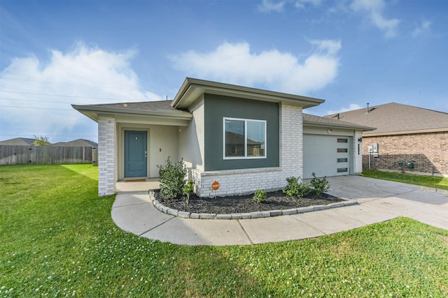 view of front of property featuring a garage, fence, a front yard, brick siding, and concrete driveway