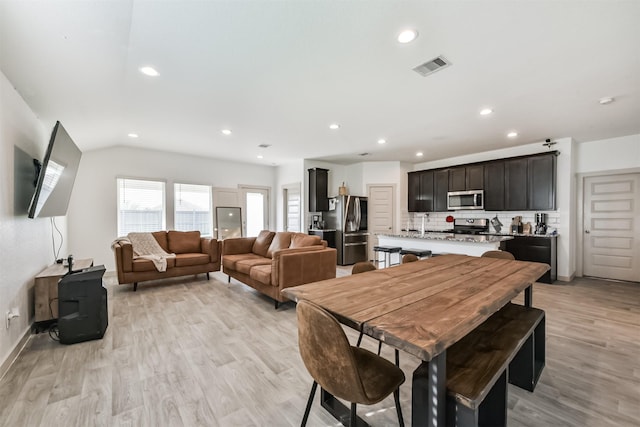 dining space featuring visible vents, recessed lighting, light wood-style flooring, and baseboards
