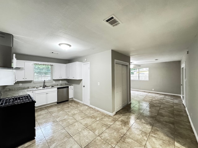 kitchen featuring visible vents, black gas stove, plenty of natural light, a sink, and dishwasher