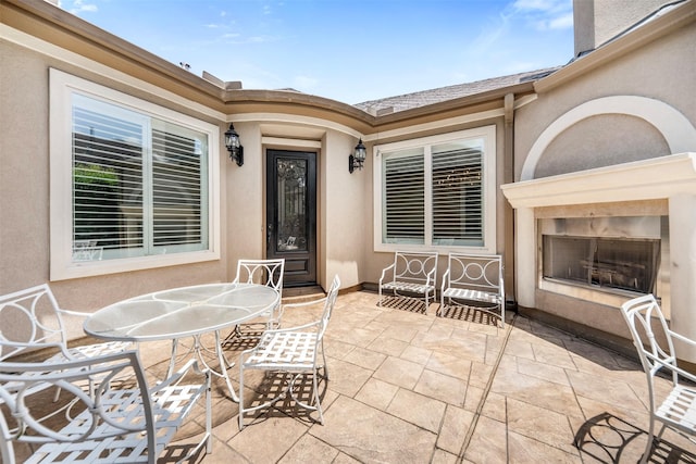 13614 Boerne Canyon Ln, Cypress, TX 77429 - view of patio / terrace featuring an outdoor fireplace and outdoor dining area