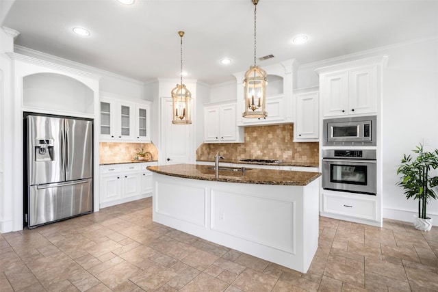 13614 Boerne Canyon Ln, Cypress, TX 77429 - kitchen featuring appliances with stainless steel finishes, stone tile flooring, a sink, tasteful backsplash, and dark stone countertops