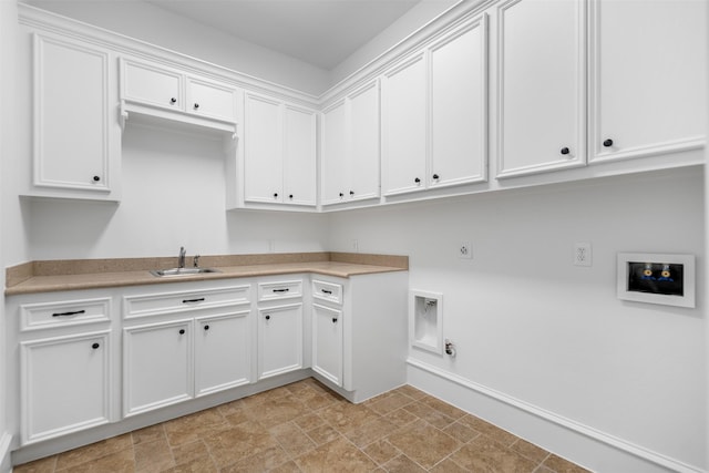 13614 Boerne Canyon Ln, Cypress, TX 77429 - laundry area with gas dryer hookup, stone finish floors, cabinet space, hookup for an electric dryer, and hookup for a washing machine