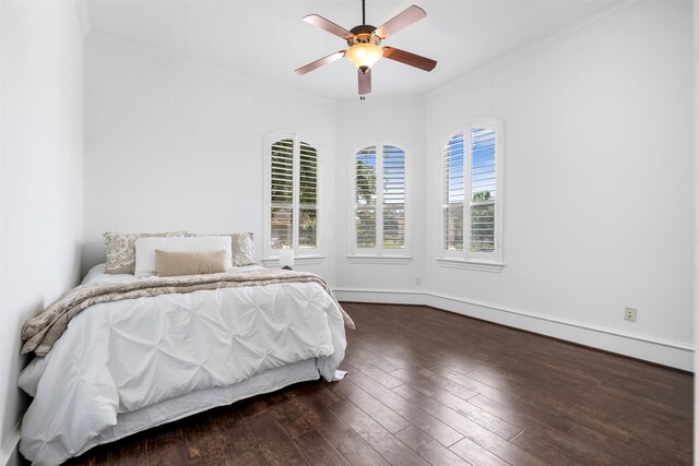 13614 Boerne Canyon Ln, Cypress, TX 77429 - bedroom with crown molding, hardwood / wood-style flooring, a ceiling fan, and baseboards