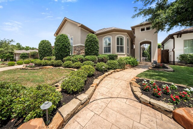 13614 Boerne Canyon Ln, Cypress, TX 77429 - mediterranean / spanish-style house with stucco siding and a front lawn