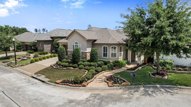 13614 Boerne Canyon Ln, Cypress, TX 77429 - french provincial home with stone siding, stucco siding, driveway, a front lawn, and a shingled roof