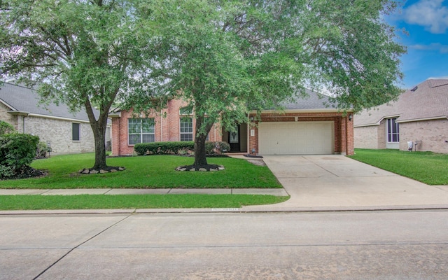 18611 Camellia Estates Ln, Cypress, TX 77429 - obstructed view of property with brick siding, a garage, a front lawn, and driveway