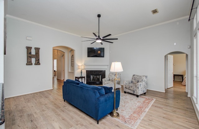 18611 Camellia Estates Ln, Cypress, TX 77429 - living area featuring visible vents, arched walkways, ceiling fan, and ornamental molding