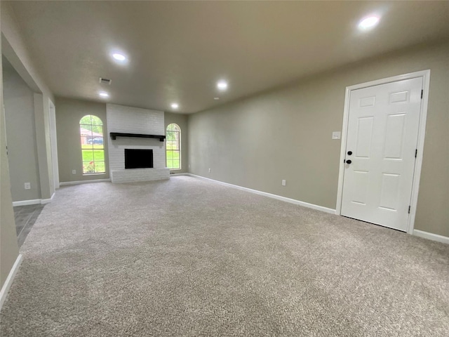 unfurnished living room featuring carpet floors, recessed lighting, and baseboards