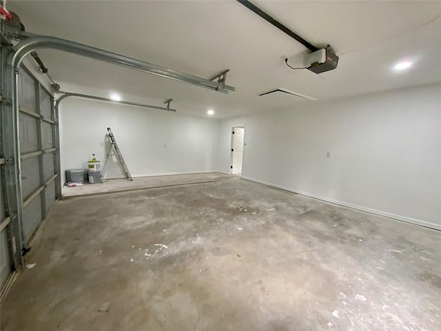 garage featuring a garage door opener and recessed lighting