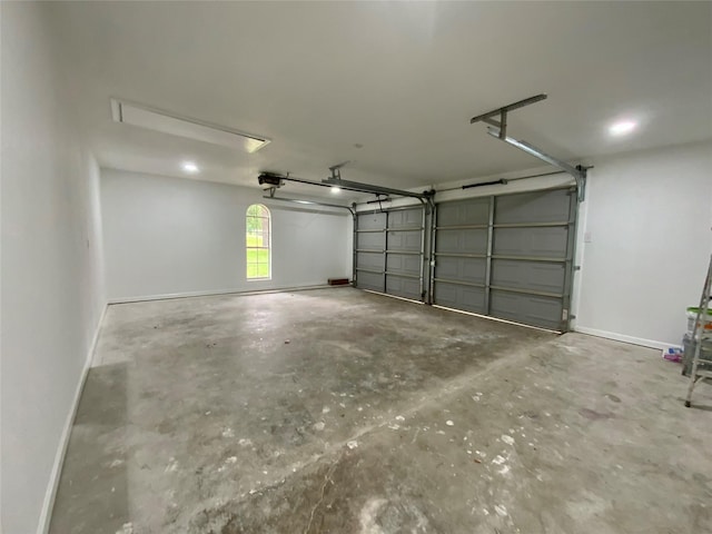 garage featuring baseboards and a garage door opener