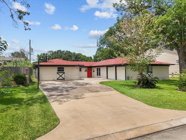 single story home with brick siding, fence, a front lawn, concrete driveway, and an attached garage