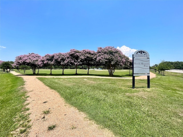 view of community featuring a lawn